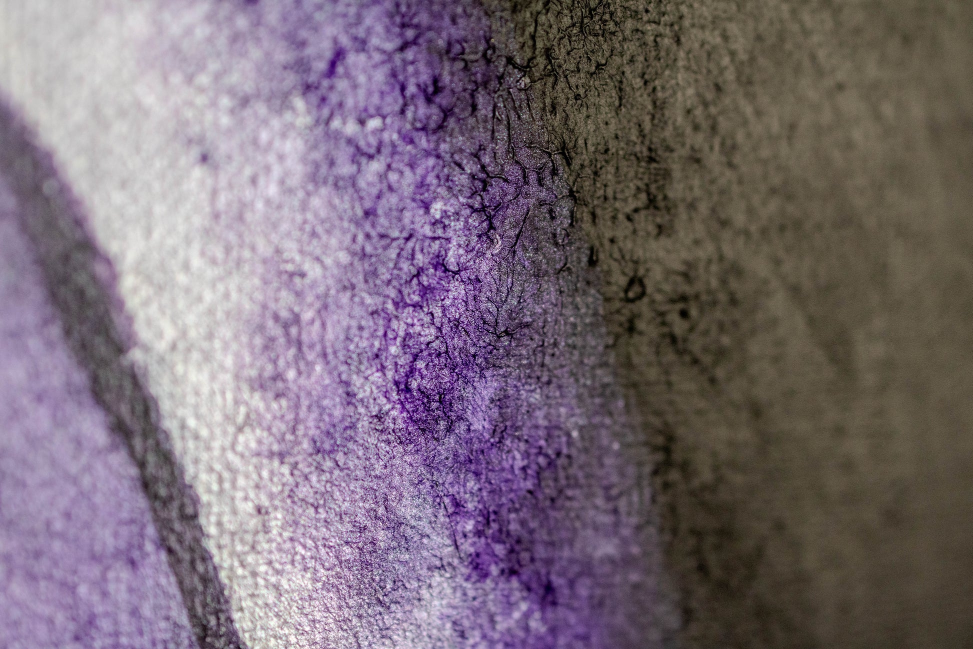 Close-up of purple cracked texture inspired by The Evolution of Her — Founder’s Edition (Limited to 120).